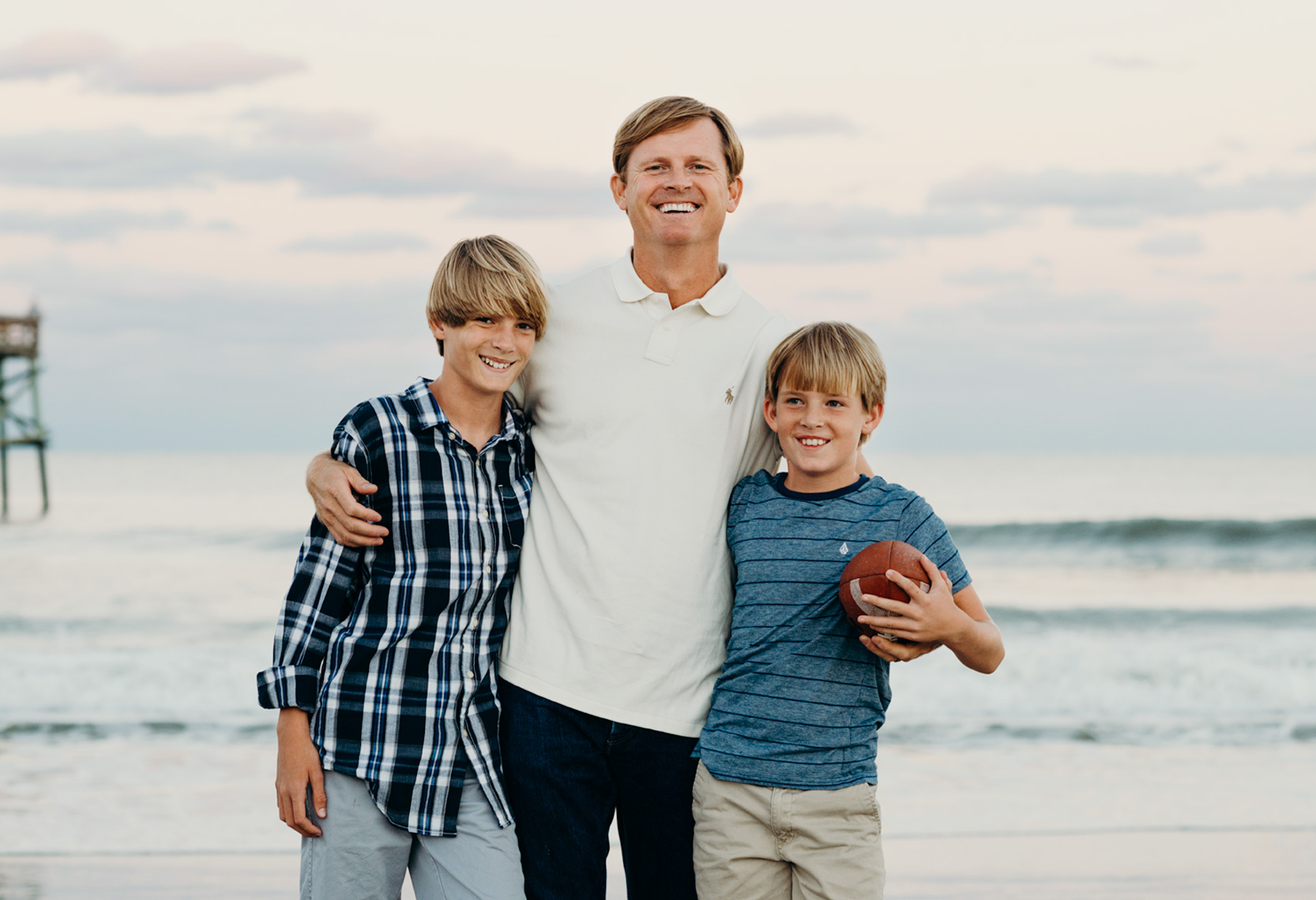 Father-Hugging-Sons-On-Beach-Amelia-Island