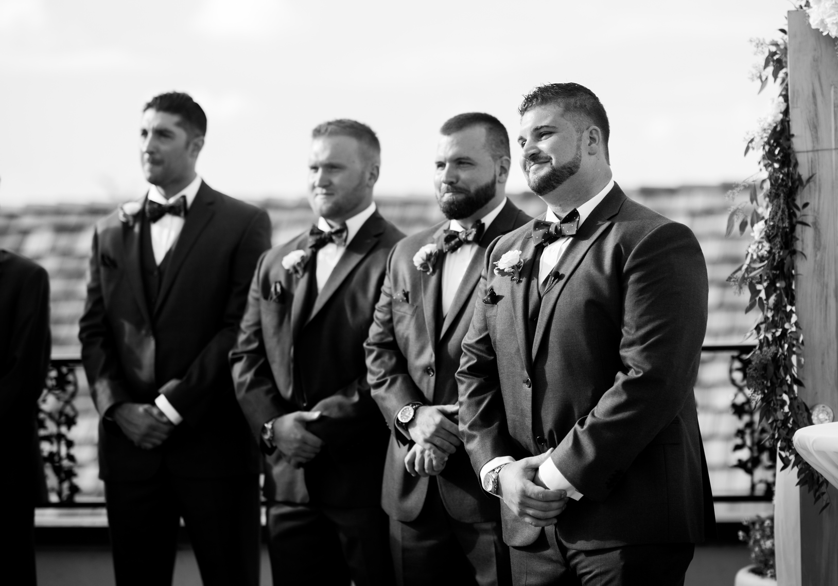 Groom-waits-as-bride-comes-down-aisle